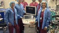 Staff surrounds technical equipment at the Spellman Lab of Anesthesiology